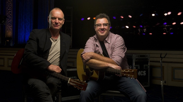 Musicians Sting, left, and Vince Gill pose for a portrait at the Hammerstein Ballroom in New York in this Sept. 20, 2011 file photo. (AP / Charles Sykes)