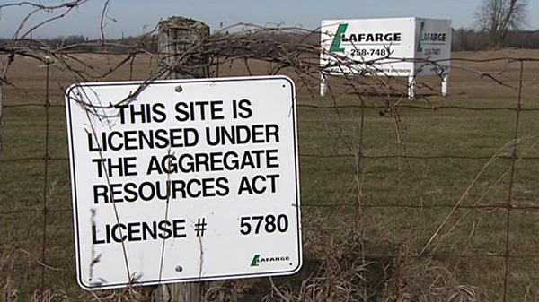 Lafarge signs sit at the site of a potential expansion near Kemptville Tuesday, Nov. 22, 2011.