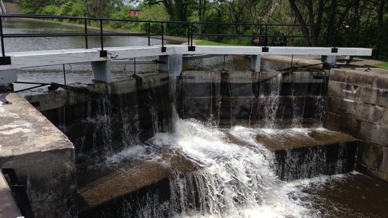 Water spills over at the Merrickville locks. Parks Canada has temporarily closed 13 lockstations along the Rideau Canal because of the dangers associated with high water levels. (Photo: Tyler Fleming/CTV Ottawa)
