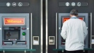 A man uses an ATM at a CIBC branch in Montreal, Thursday, April 24, 2014. (Graham Hughes / THE CANADIAN PRESS)