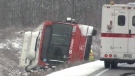 The driver of an OC Transpo bus had to crawl through the emergency exit on the roof after it slipped on its side Wednesday morning.