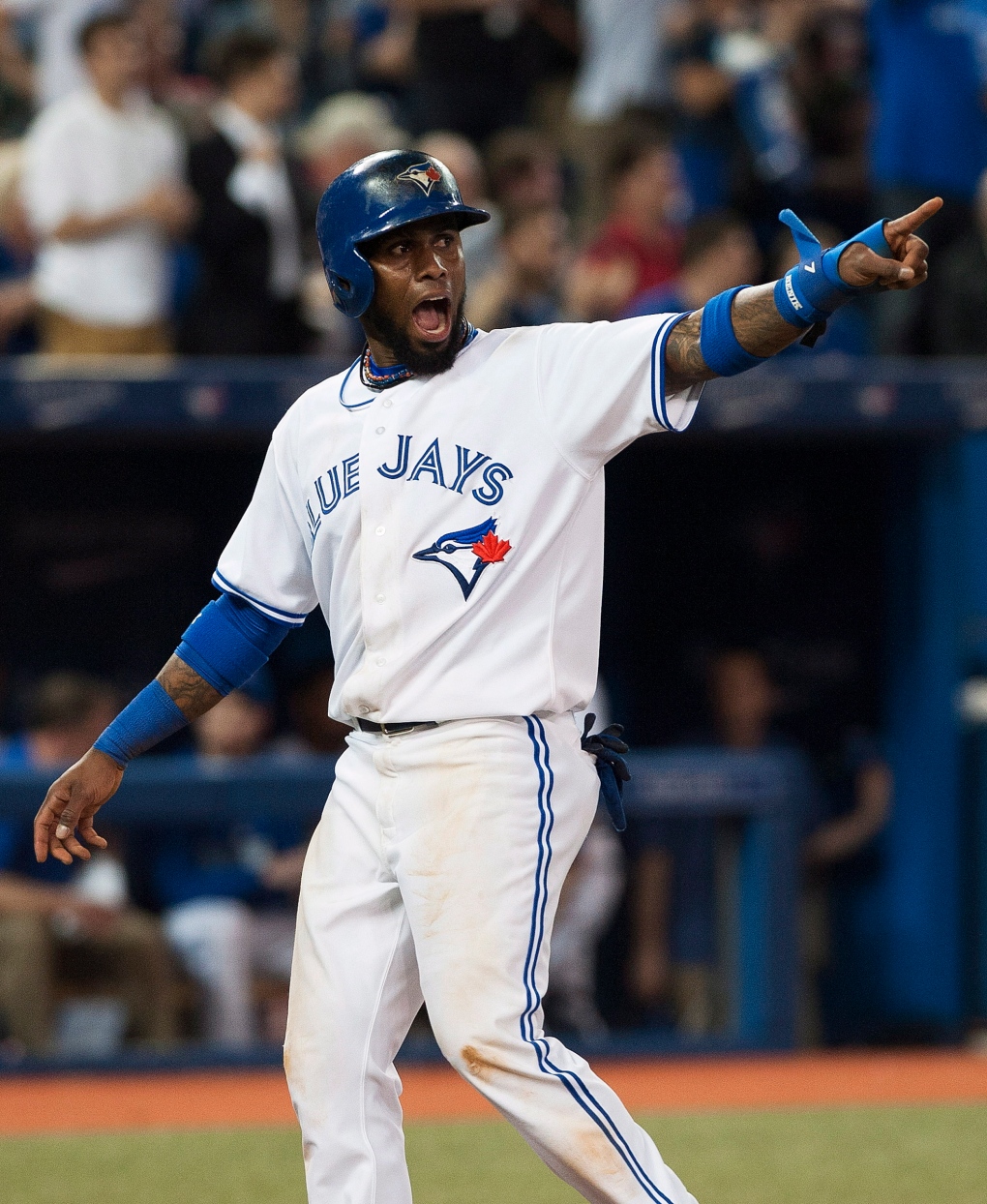 Jays Jose Reyes reacts after getting a run hit 