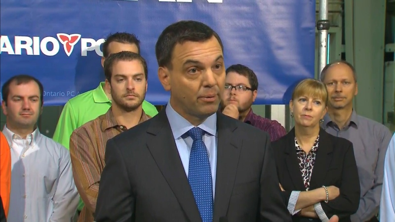 Progressive Conservative Leader Tim Hudak addresses reporters during a campaign stop in Niagara Falls, Ont., on Wednesday, May 28, 2014.