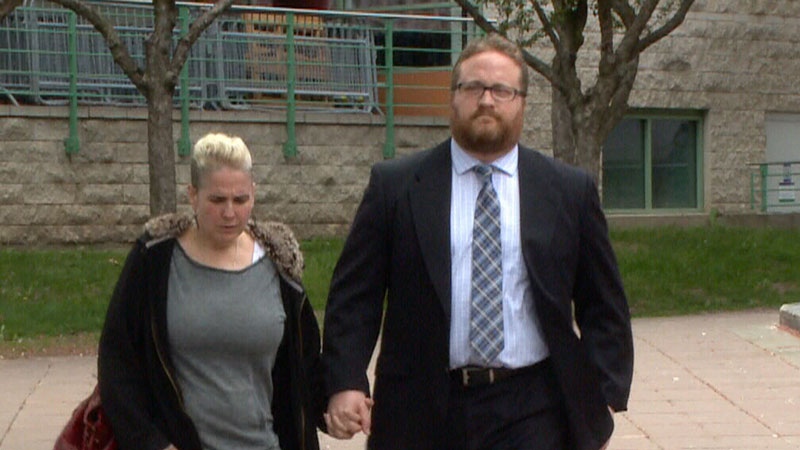 Clinton Russell and his wife head into court in Ottawa on Wednesday, May 28, 2014.