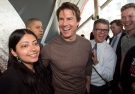 Tom Cruise laughs while posing with fans at the premiere of his new film 'Edge of Tomorrow' in Toronto on Thursday, May 29, 2014. (Darren Calabrese / THE CANADIAN PRESS)