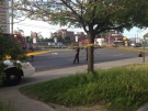 Yellow police tape cordons off an area of the intersection at Eglinton and Midland avenues where a pedestrian was struck by a vehicle Sunday June 1, 2014.  (@JaejaeHermoso /Twitter)