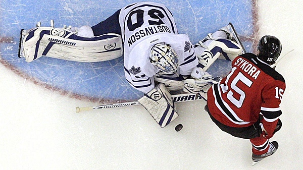 Toronto Maple Leafs goalie Jonas Gustavsson (50) stops a shot by New Jersey Devils' Petr Sykora (15) during the second period of an NHL hockey game on Wednesday, Nov. 2, 2011, in Newark, N.J. (AP Photo/Julio Cortez)