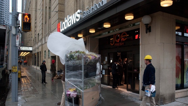 Flowers are brought into a Loblaws store at the site of the old Maple Leaf Gardens in Toronto on Tuesday Nov. 29, 2011. (Chris Young / THE CANADIAN PRESS)