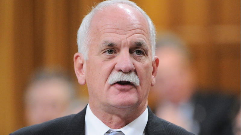 Minister of Public Safety Vic Toews a question during question period in the House of Commons on Parliament Hill in Ottawa on Wednesday, November 30, 2011. THE CANADIAN PRESS/Sean Kilpatrick