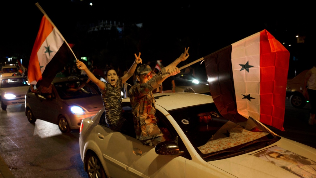 Syrian soldiers celebrate Assad's election win