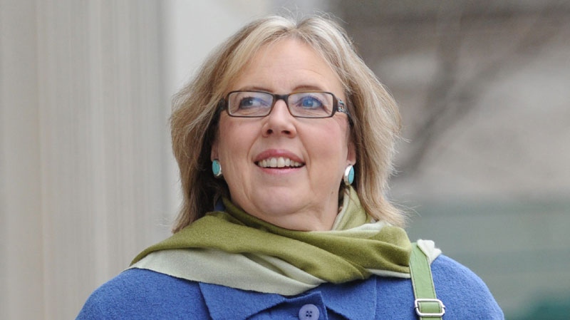 Green Party Leader Elizabeth May leaves a press conference in Ottawa on Dec. 1, 2011