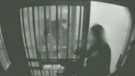 In this still taken from a cellblock video, a Gatineau police officer (left) is shown allegedly assaulting a female inmate in April 2010.