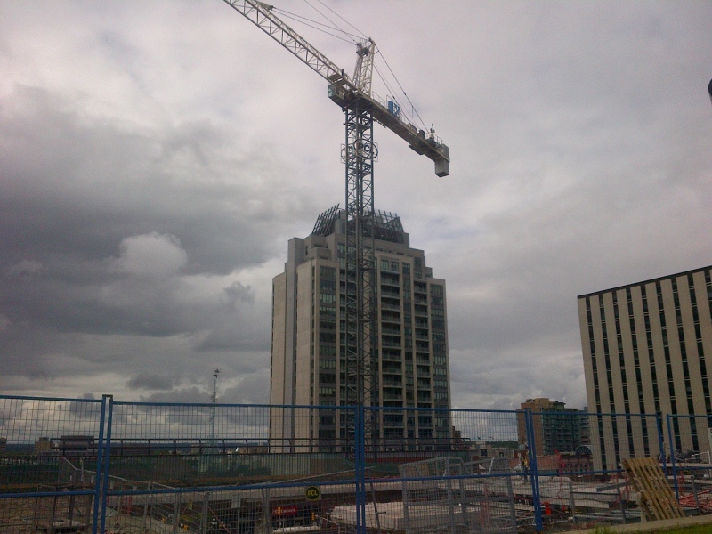 A construction crane towers above the expansion site at the Rideau Centre in downtown Ottawa, June 6, 2014.