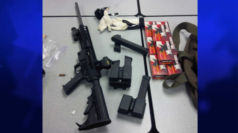 The London Police Service provided this image of an assault rifle and ammunition seized by police in London, Ont. on Monday, June 9, 2014.