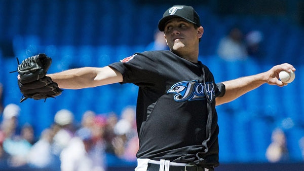 Toronto Blue Jays pitcher Brad Mills works against the Oakland Athletics during second inning MLB action in Toronto Thursday August 11, 2011. Mills gave up six runs in the third inning.THE CANADIAN PRESS/Aaron Vincent Elkaim