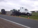 A flipped tractor trailer sits in a ditch on Highway 401 at Kent Bridge Road, following an over night collision on Wednesday, June 11, 2014. (Chris Campbell/ CTV Windsor)