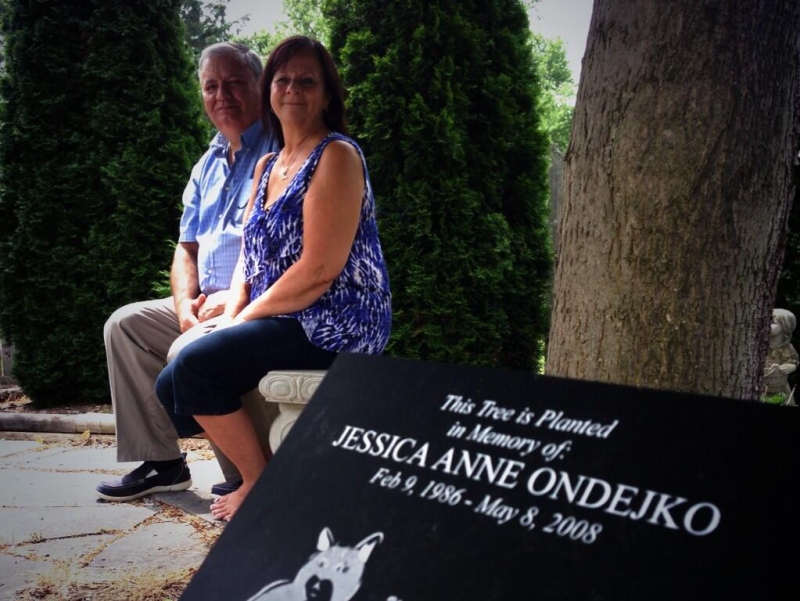 Jim and Nancy Ondejko sit at their daughters grave in Amherstburg, Ont. on Tuesday, June 10, 2014. (Sacha Long/ CTV Windsor)