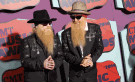 Dusty Hill, left, and Billy Gibbons of the musical group ZZ Top arrive at the CMT Music Awards at Bridgestone Arena in Nashville, Tenn., on Wednesday, June 4, 2014. (Wade Payne / Invision)