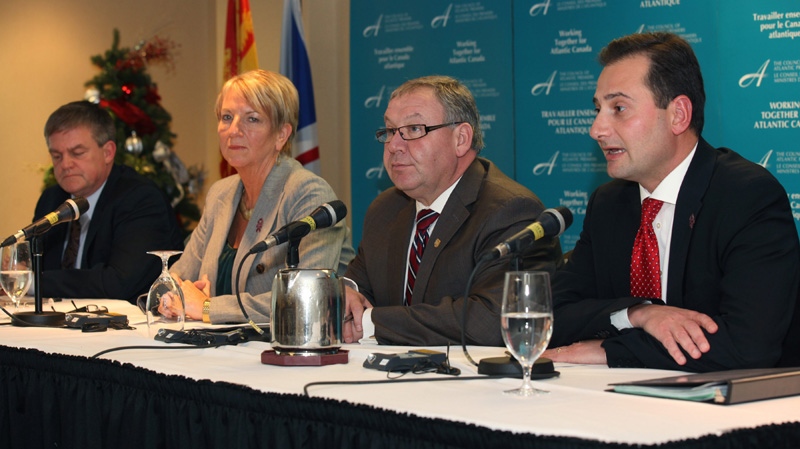 From left, Premiers David Alward of New Brunswick, Kathy Dunderdale of Newfoundland and Labrador, Darrell Dexter of Nova Scotia and Robert Ghiz of P.E.I., attend a press conference following the 20th session of the Council of Atlantic Premiers in St. John's, N.L. on Monday Dec. 5, 2011. THE CANADIAN PRESS/Paul Daly