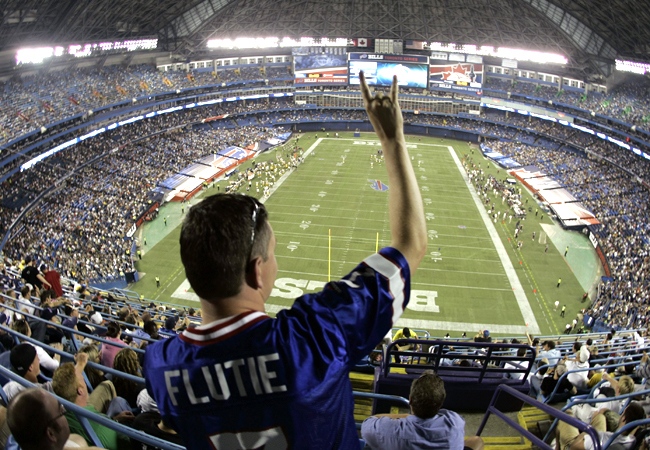 Buffalo Bills fan Dan Malette, of North Bay, Ont., tries to get the attention of a friend during the second half of a pre-season NFL football game between the Bills and the Pittsburgh Steelers at the Rogers Centre in Toronto, Thursday, Aug. 14, 2008. (AP / David Duprey)