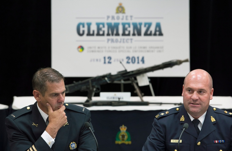 Mario Desmarais, left, with the Montreal Police Department and Michel Arcand with the RCMP speak to reporters during a news conference at RCMP headquarters in Montreal, Thursday, June 12, 2014, where they spoke about Project Clemenza. THE CANADIAN PRESS/Graham Hughes