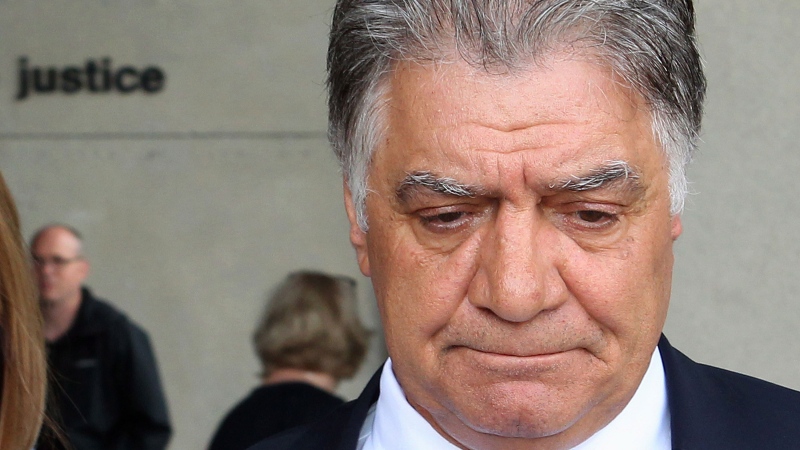 Then-London mayor Joe Fontana walks away from the London, Ont., courthouse after hearing the verdict in his fraud trial on Friday June 13, 2014. (Dave Chidley / THE CANADIAN PRESS)