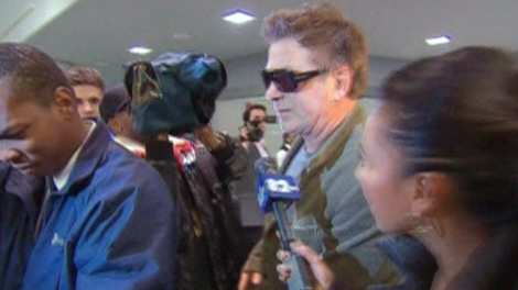 Actor Alec Baldwin is seen in an airport in New York, just hours after being kicked off an American Airlines flight, Tuesday, Dec. 7, 2011.