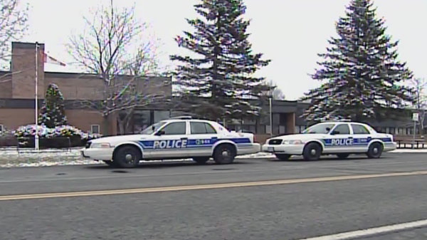 Police and paramedics respond to South Carleton High School in Richmond Wednesday, Dec. 7, 2011.