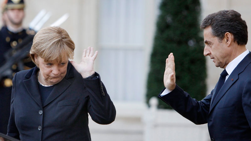 French President Nicolas Sarkozy waves goodbye to German Chancellor Angela Merkel as she leaves the Elysee Palace following their meeting in Paris, Monday Dec. 5, 2011. (AP / Remy de la Mauviniere)
