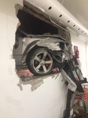 The front-end of a Dodge Caliber that struck the Fuente De Vida Church on Seminole Street can be seen from within the church's basement on Tuesday, June 17, 2014. (Marvin Calito/ Viewer photo)