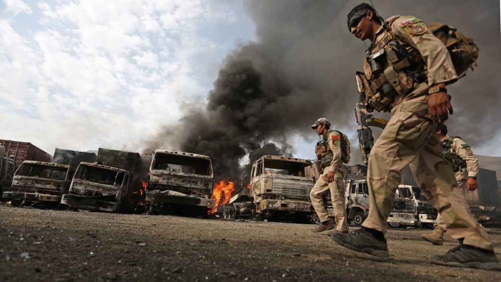 Afghan policemen react to suicide attack