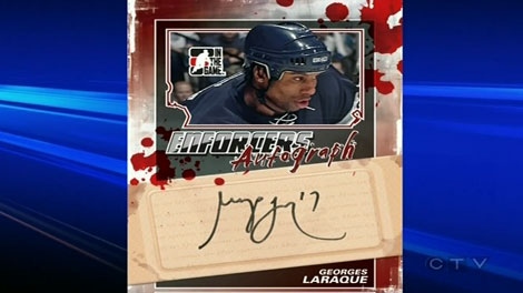 Georges Laraque wants the blood off his trading card.