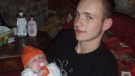 Victim of a fatal collision on Highway 401, Jason Eligh, is seen here with his baby in an undated photo.