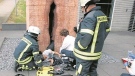 Fire officials attempt to rescue a U.S. exchange student from a vagina sculpture in southwestern Germany. (Erick Guzman / Imgur)