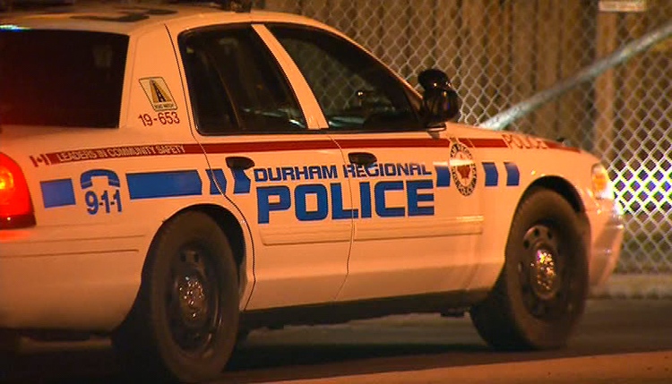 A Durham Regional Police cruiser arrives at the Toronto Police Service's 31 Division following early-morning raids across Toronto and the GTA, Tuesday, Dec. 13, 2011.