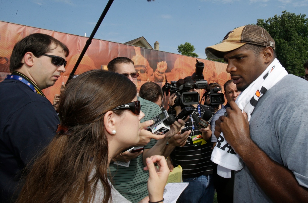 Michael Sam talks with media at NFL youth event