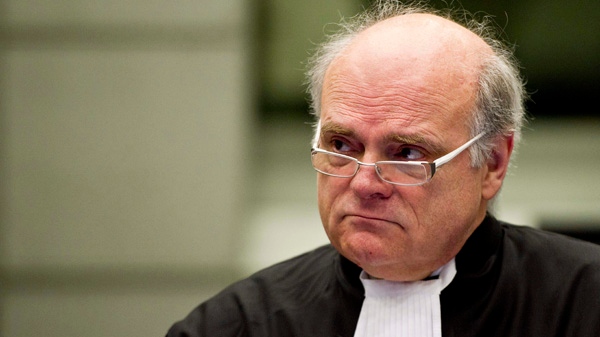 Prosecutor Daniel Bellemare of Canada looks up in the court room of the Hariri tribunal in Leidschendam, Netherlands, Monday Feb. 7, 2011. (AP /Valerie Kuypers)