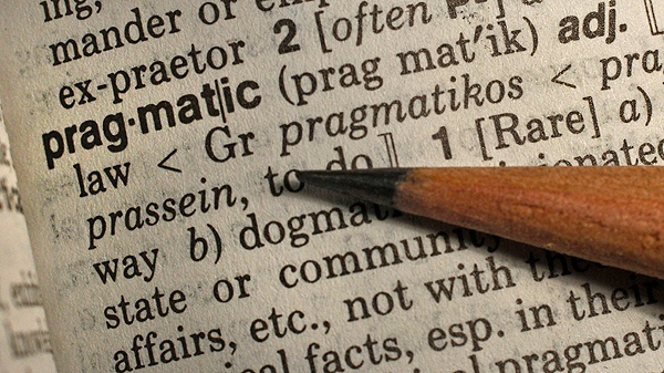 A pencil points out "Pragmatic", Merriam-Webster's annual word of the year in Boston, Wednesday Dec. 14, 2011. (AP Photo/Charles Krupa)