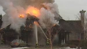 Crews battled the blaze on Shoreline Drive the morning of Dec. 16, 2011 in Winnipeg. 