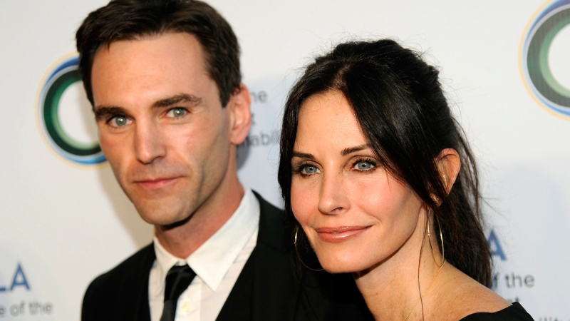 Actress Courteney Cox, right, and her musician boyfriend Johnny McDaid at the UCLA Institute of the Environment and Sustainability's An Evening of Environmental Excellence in Beverly Hills, Calif., March 21, 2014. (AP / Chris Pizzello / Invision)