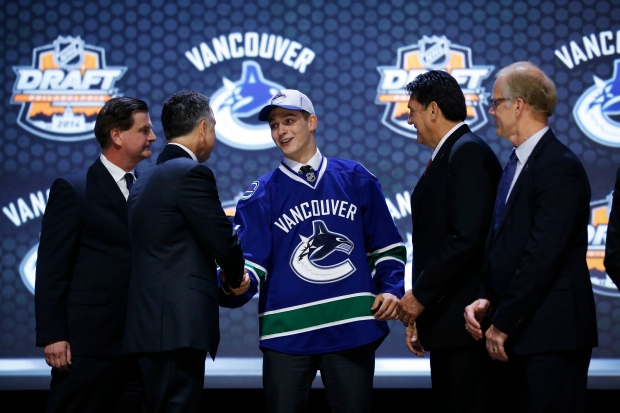 Jake Virtanen shakes hands with Vancouver Canucks