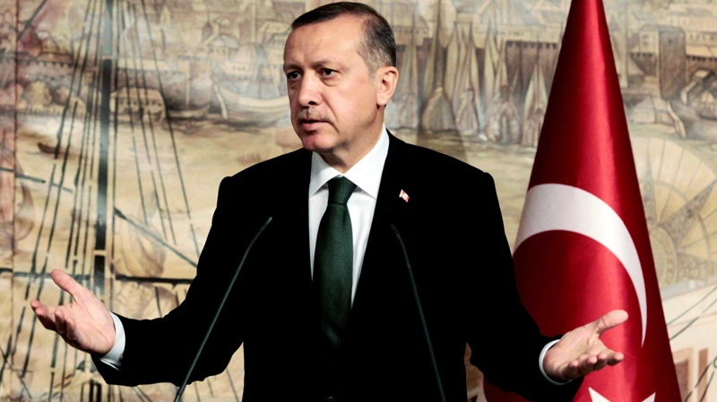 Turkish Prime Minister Recep Tayyip Erdogan speaks during a joint news conference with Mustafa Abdul-Jalil, the chairman of Libya's National Transitional Council, in Istanbul, Turkey, Saturday, Dec. 17, 2011. (AP Photo)
