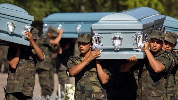 Soldiers carry coffins during the funeral of six members of Mexico's Army that were found decapitated in Chilpancingo, Mexico. (AP Photo/Claudio Cruz, File)