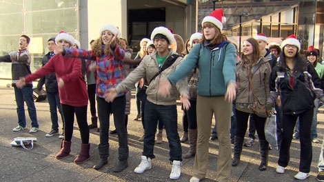 Several teens danced and sang in a flash mob held against climate change in downtown Vancouver. Dec. 18, 2011. (CTV) 