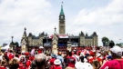 People gather on Parliament Hill for Canada Day entertainment, Tuesday, July, 1, 2014. (Mike Cormier / MyNews)