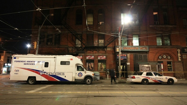 Police park outside of a building where a woman's body was discovered on Dec. 18, 2011. 