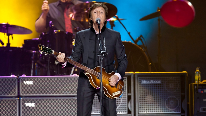 Sir Paul McCartney performs on stage during his 'Good Evening Europe' European Tour, his first since 2003, at Olympic Hall in Moscow, Russia, Wednesday, Dec. 14, 2011. (AP / Alexander Zemlianichenko)