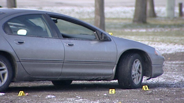 Evidence markers are visible at the scene of a murder outside the Masonic Lodge in Cambridge, Ont. on Saturday, Dec. 17, 2011.