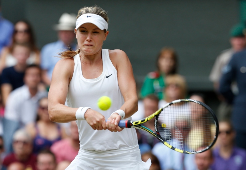 Eugenie Bouchard of Canada plays a return to Petra Kvitova of the Czech Republic during the women's singles final at the All England Lawn Tennis Championships in Wimbledon, London, Saturday July 5, 2014. (AP Photo/Sang Tan)