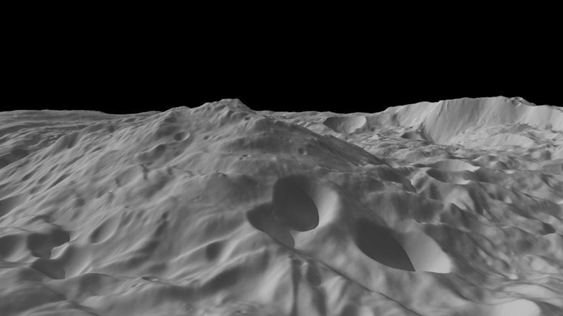 An image provided by NASA show a Dawn spacecraft view of a mountain three times as high as Mt. Everest, amidst the topography in the south polar region of the giant asteroid Vesta. (AP Photo/NASA)